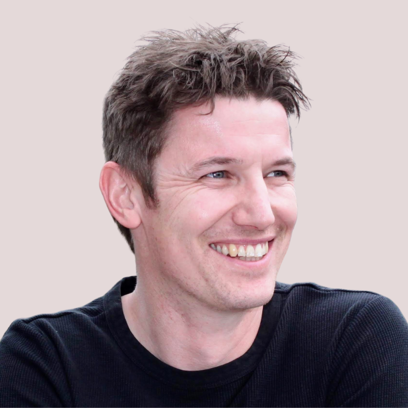 green blog background with black and white image of quantilope office and James' headshot